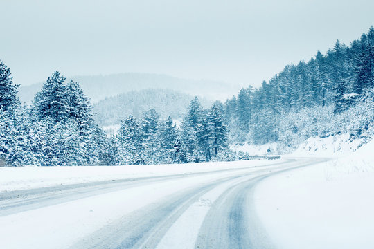 Mountain road landscape covered in snow in winter 