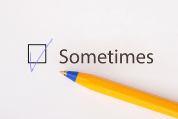 Sometimes - checkbox with a tick on white paper with yellow pen. Checklist concept.