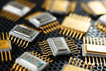 Electronic microchips close-up. Golden electronic components.