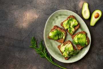 Top view of avocado toasts in a plate