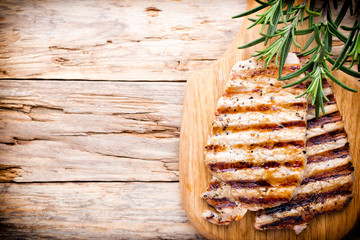 Grilled pork chops pieces. Spices and rosemary.