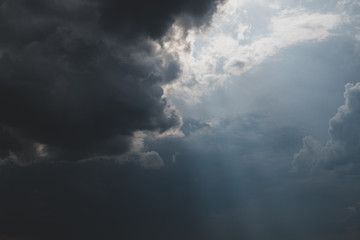 Obraz premium Sunlight through storm clouds