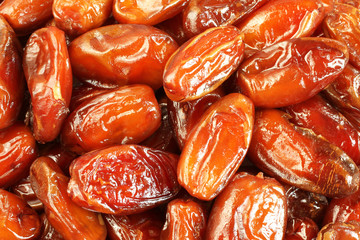 Dried dates situated arbitrarily. Food background