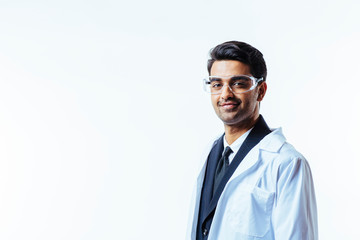Portrait of a man in business suit, lab coat and protective glasses, looking at camera, isolated on...