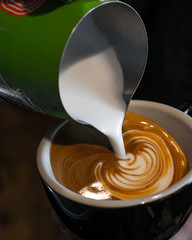 Professional latte art being poured 