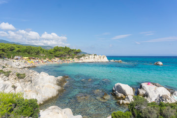 Sunny day on Orange beach of halkidiki, greece. Beautiful beach with clear turquoise blue water