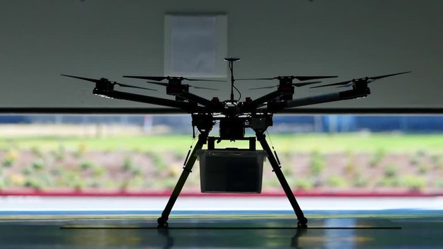 Drone Delivery Warehouse Door Opens Awaiting for Drone Takeoff from Shipping Warehouse 