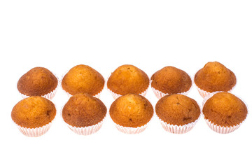 Tasty little homemade muffins on white background. Studio Photo