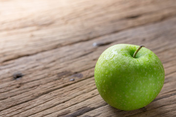 Fresh Green Apple on Wood