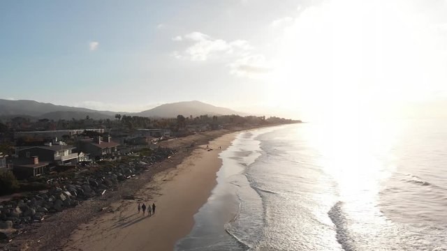 Sunrise Drone Jib Back Along Beach