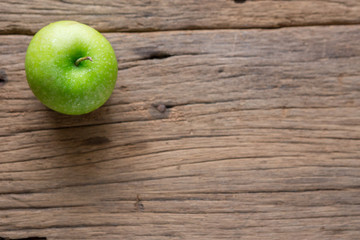 Fresh Green Apple on Wood