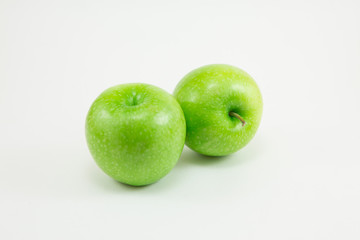 Green apples on white background