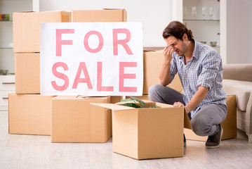 Young man offering home for sale and moving out 