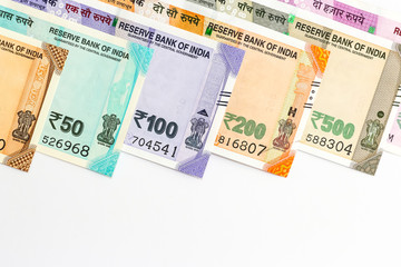 Close up view of brand new indian 10, 50, 100, 200, 500 and 2000 rupees banknotes. Colorful money background.