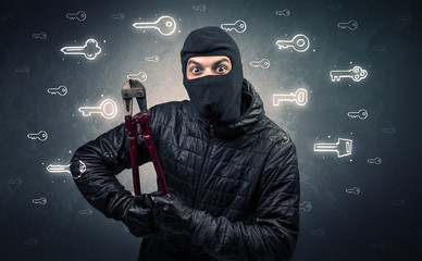 Burglar standing with tools in his hand.