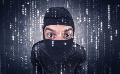 Burglar in action with encoded concept and his tools in his hand. 