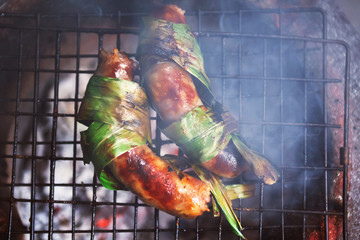 Grilled sausage herb on fire