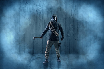 Dreadful dangerous man with wood, shanty wallpaper and fume around
