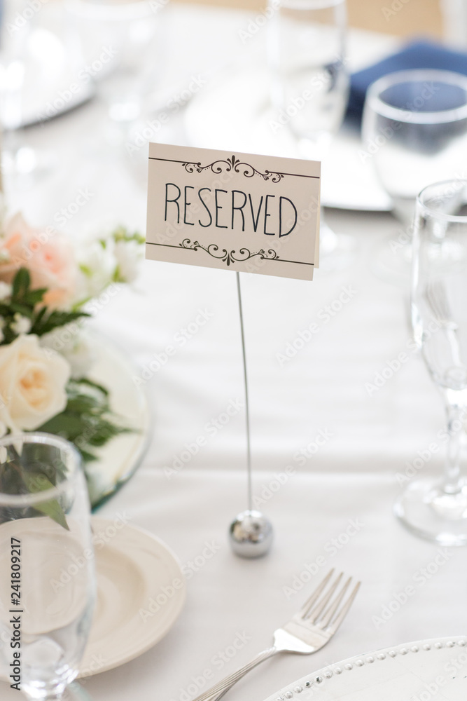 Wall mural reserved table sign on wedding reception