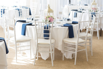 Interior wedding reception setup tables white linens