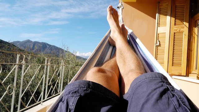 Man relaxing in hammock