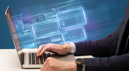 Hand typing on laptop with online accounting system concept
