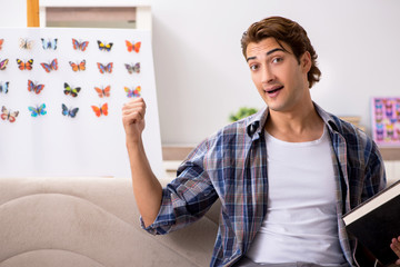 Student entomologist studying new species of butterflies