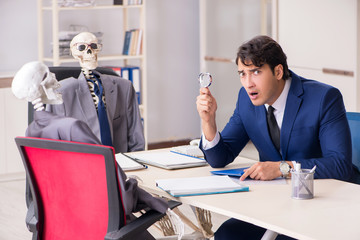 Funny business meeting with boss and skeletons