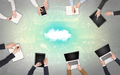 Group of people with devices in hands working on reports with online teamwork and cloud technology...