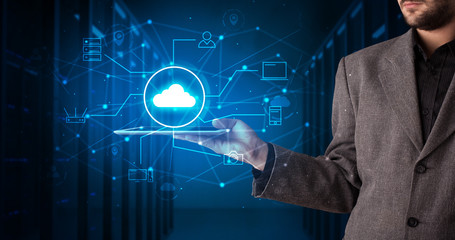 Formal hand in server room with virtual workspace concept
