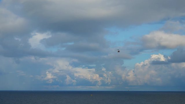 Helicopter heading and landing on an offshore oil rig , service travel to oil and gas platform and drilling rig in offshore locations