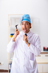 Young male doctor otolaryngologist working at the hospital 