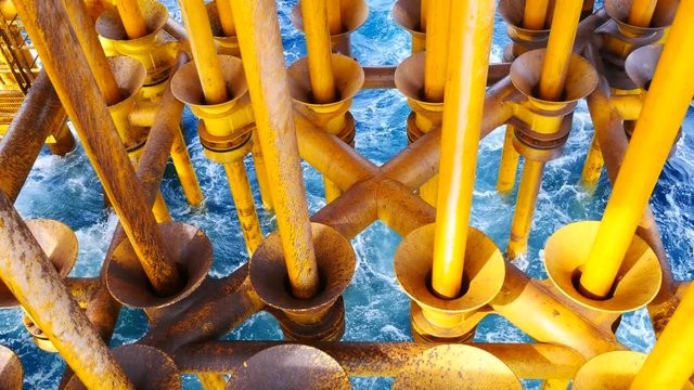 High Waves Hit Oil and Gas Producing Slots and Platform Legs at Offshore Platform - Oil and Gas Industry