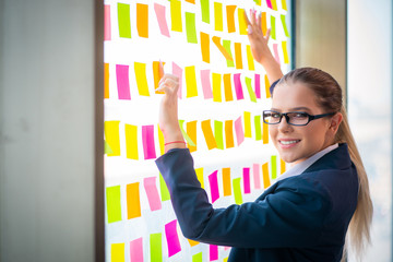 Beautiful female employee with many conflicting priorities 