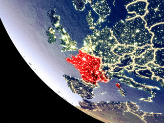 Orbit view of France at night with bright city lights. Very detailed plastic planet surface.