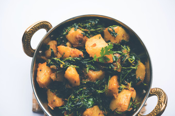 Fenugreek potato sabzi or Aloo Methi masala is healthy Indian Cuisine. served in a bowl or karahi. selective focus