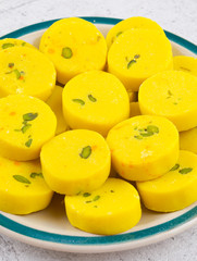 Naklejka na ściany i meble Indian Sweet Food Kesar Peda Also Know as Kesar Mawa Peda, Saffron Sweet, Saffron Peda, Pedha, Pera or Peday is a Saffron Flavoured Soft, Dense Sweet That is Specially Made During Festivals