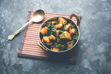 Fenugreek potato sabzi or Aloo Methi masala is healthy Indian Cuisine. served in a bowl or karahi. selective focus