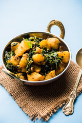 Fenugreek potato sabzi or Aloo Methi masala is healthy Indian Cuisine. served in a bowl or karahi....