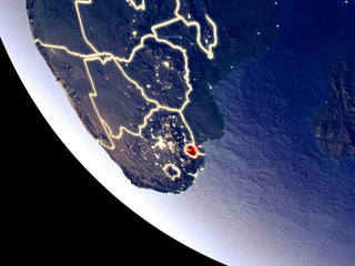 Orbit view of eSwatini at night with bright city lights. Very detailed plastic planet surface.