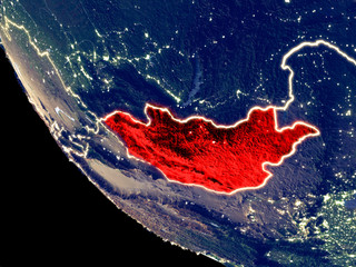 Orbit view of Mongolia at night with bright city lights. Very detailed plastic planet surface.