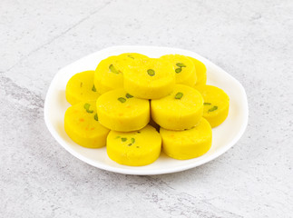 Naklejka na ściany i meble Indian Sweet Food Kesar Peda Also Know as Kesar Mawa Peda, Saffron Sweet, Saffron Peda, Pedha, Pera or Peday is a Saffron Flavoured Soft, Dense Sweet That is Specially Made During Festivals