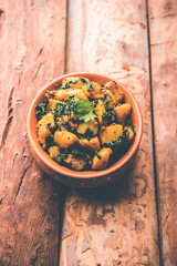 Fenugreek potato sabzi or Aloo Methi masala is healthy Indian Cuisine. served in a bowl or karahi. selective focus