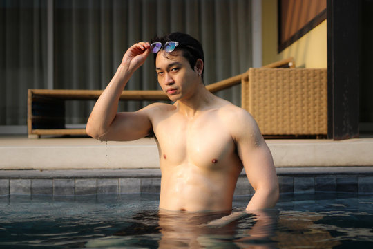 Sexy Asian Man In Swimming Pool