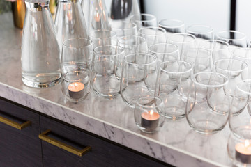 Ornate glassware elegantly sitting on the bar at a formal event.