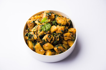 Fenugreek potato sabzi or Aloo Methi masala is healthy Indian Cuisine. served in a bowl or karahi. selective focus
