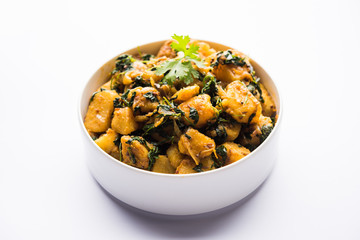 Fenugreek potato sabzi or Aloo Methi masala is healthy Indian Cuisine. served in a bowl or karahi. selective focus