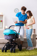 Young parents with baby expecting new arrival