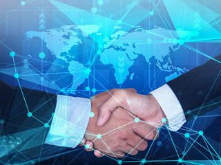 background of businessmen handshaking with background of global map and foreground of network symbol