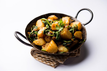 Aloo Palak sabzi - Potato cooked with spinach with added spices. a healthy Indian main course...